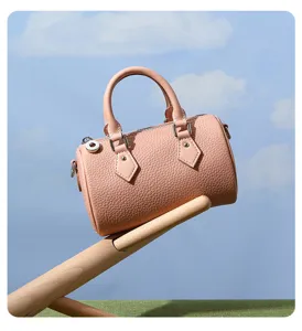 Detail view of pink genuine leather women Boston handbag, casual minimalist shoulder bag.