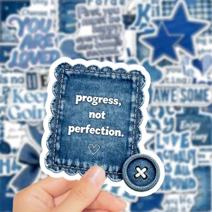 Close-up of vintage blue denim aesthetic sticker featuring inspirational quote for decoration.