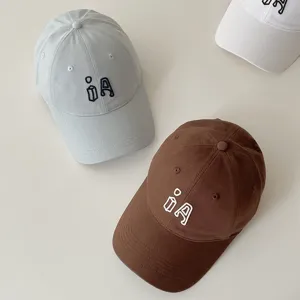 Kids cotton baseball cap with cute embroidery letter, stylish casual sun visor hat for spring.