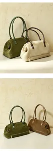 Detailed view of genuine leather suede shoulder bags in olive green and beige colors.