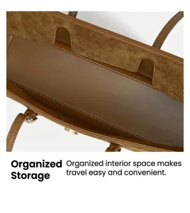 Interior detail view of the brown leather tote bag showcasing spacious compartment and fine suede lining.