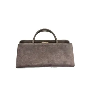 Retro suède handtas van echt leer met handvat en metalen sluiting voor dames hoofdaanzicht.