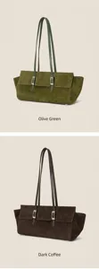 Minimalist suede shoulder bag with double straps and metal buckle details in olive and coffee.