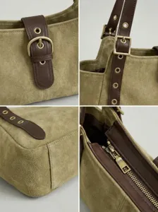 Bolso de hombro de ante verde con correas de cuero marrón y hebillas metálicas elegantes.