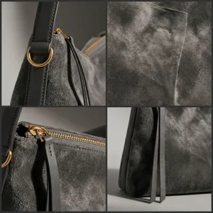 Minimalist suede shoulder bag with premium gold-toned hardware and sleek zipper closure.