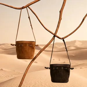 Genuine leather bucket bag for women, stylish crossbody shoulder bag with drawcord design.