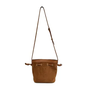 Brown suede bucket bag for women, stylish leather crossbody shoulder bag with adjustable strap.