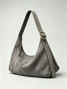 Grey suede shoulder bag for women, stylish hobo purse with studded strap and zip closure.