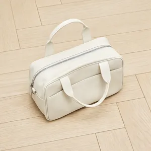 Elegant white leather bowling bag, chic commuter top handle crossbody Boston handbag.