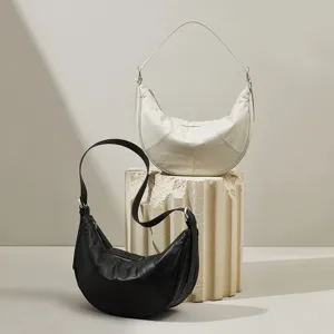 Minimalist leather crescent shoulder bag, high-end half-moon underarm bag for women.