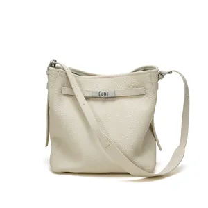 Beige leather bucket shoulder bag for women, luxury top grain cowhide crossbody handbag.