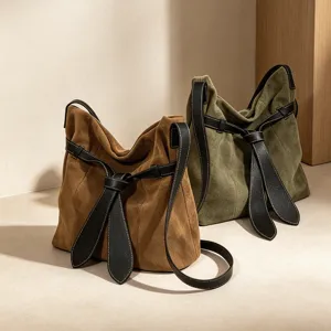 Women suede shoulder bag with black leather knot strap, chic underarm bag for winter daily use.
