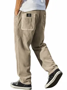 Pantalon de contrat en velours cotes coupe droite ample poches dos style decontracte.