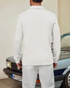 Detailed view of men solid color long sleeve knit polo shirt with lapel in casual style.