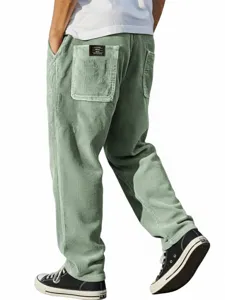 Pantalon decontracte en velours cote homme coupe large droit vert clair avec etiquette poche