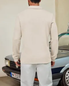 Detailed back view of men's casual long sleeve knit polo shirt in solid beige color for autumn style.