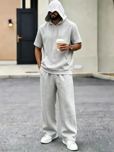 Men's casual sportswear set, short sleeve hooded top and loose summer trousers in grey.