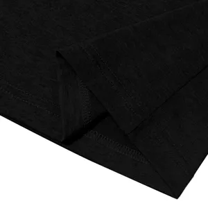 Close-up detail of dark textured fabric hem, showing neat and durable double-needle stitching craftsmanship.