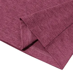 Close-up detail of the garment hem showing fine double-stitching and soft heathered fabric texture.