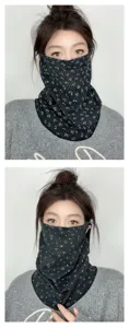 Detailed view of winter thermal cycling face mask neck gaiter with cute print for outdoor warmth.