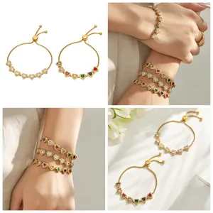 Gold tone heart zirconia bracelet detail shot showcasing sparkling multi-color stones and slider.