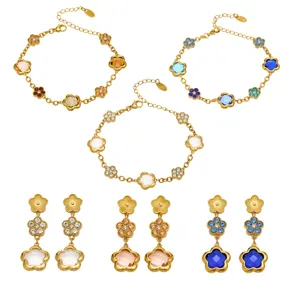 Gold-plated flower charm bracelet and earrings set with colorful crystal stones for women.