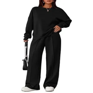 Zwarte sweater met lange mouwen en comfortabele wijde broek tweedelig set details.