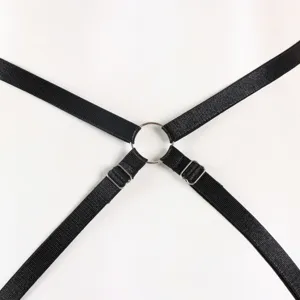 Black elastic strap detail harness close-up with silver metal rings and adjustable buckles.