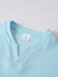 Men's casual light blue waffle long sleeve T-shirt collar detail with size S tag.