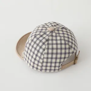 Cute plaid baby baseball cap with soft brim, comfortable infant sun hat for boys and girls.