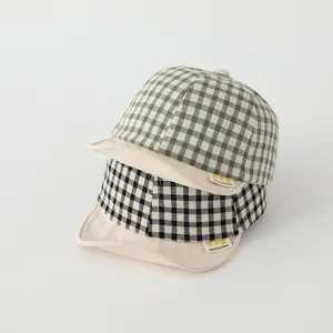 Detail shot of cute baby baseball caps with soft brims in classic gingham patterns.