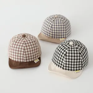 Cute baby plaid baseball hat, soft brim sun cap detail view for infant boys and girls.