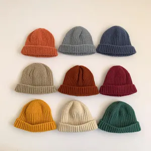 Colorful knit beanie caps detail, ribbed texture, soft wool material for kids autumn winter.