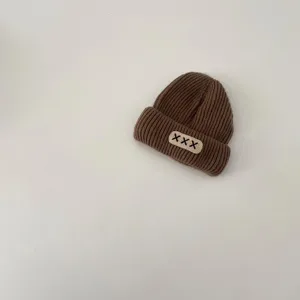 Brown knit beanie for kids, autumn winter warm pull-on hat with cute embroidered patch detail.