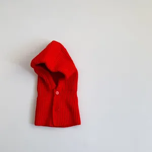 Kids winter knitted hooded scarf detail view, solid red warm baby balaclava hat piece.