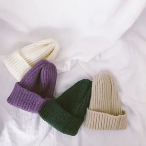 Soft kids knitted beanie hat detail showing cozy solid color texture and multi-color options.