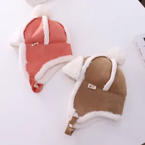 Detailed view of children plush earflap winter hat, soft warm thick material closeup.