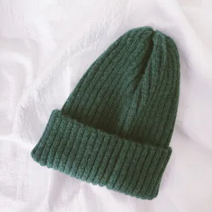 Detail of kids solid color warm knit beanie, soft and comfortable for daily winter wear.