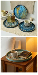 Decorative round wooden serving tray with creative painted pattern for home decor table.