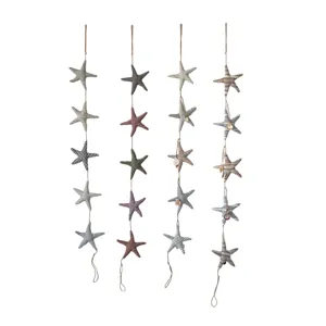 Coastal fabric starfish hanging string set, charming nautical wall decor for kids room and nursery.