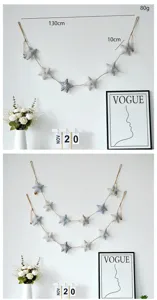 Guirlanda colgante de pared de estrella de tela para decoración de habitación infantil.