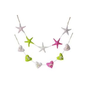 Guirlanda colgante creativa de tela colorida estrella de mar y corazón decoración de pared.