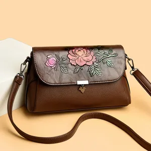 Damen Vintage Leder Umhängetasche Blumen geprägt elegante Handtasche Hauptansicht.