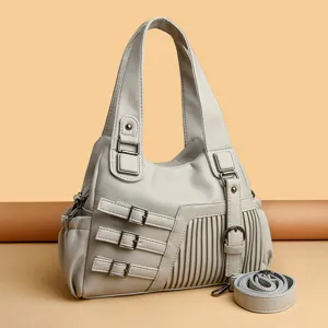 Damen weiche Leder Schultertasche lässige vielseitige Handtasche mit dekorativen Schnallen.