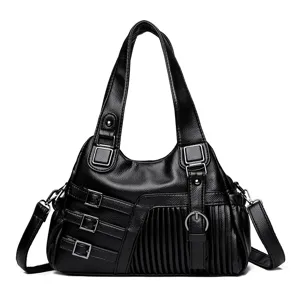 Schwarze Damen Umhängetasche aus weichem Leder, lässige Crossover Tasche mit Metall Schnallen.