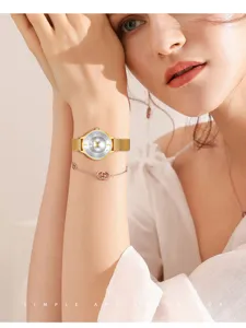 Elegant women quartz watch with diamond dial and mesh stainless steel strap, stylish wrist watch.