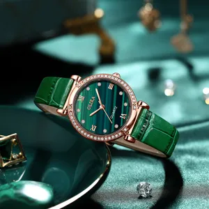 Stylish women's quartz watch with green malachite dial, rhinestone bezel, and green leather strap.