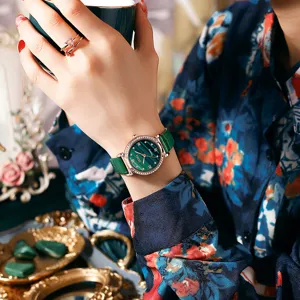 Green dial quartz watch for women with rhinestones bezel and leather strap main view.