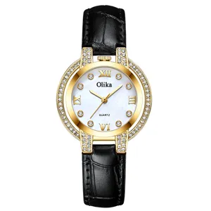 Women quartz watch with rhinestone bezel, white mother-of-pearl dial and black leather strap.