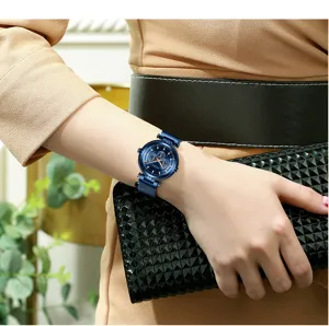 Detail shot of a stylish women quartz watch with blue dial and magnetic mesh strap.